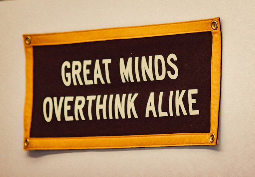 a sign that says great minds overthink alike