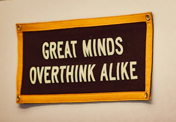 a sign that says great minds overthink alike