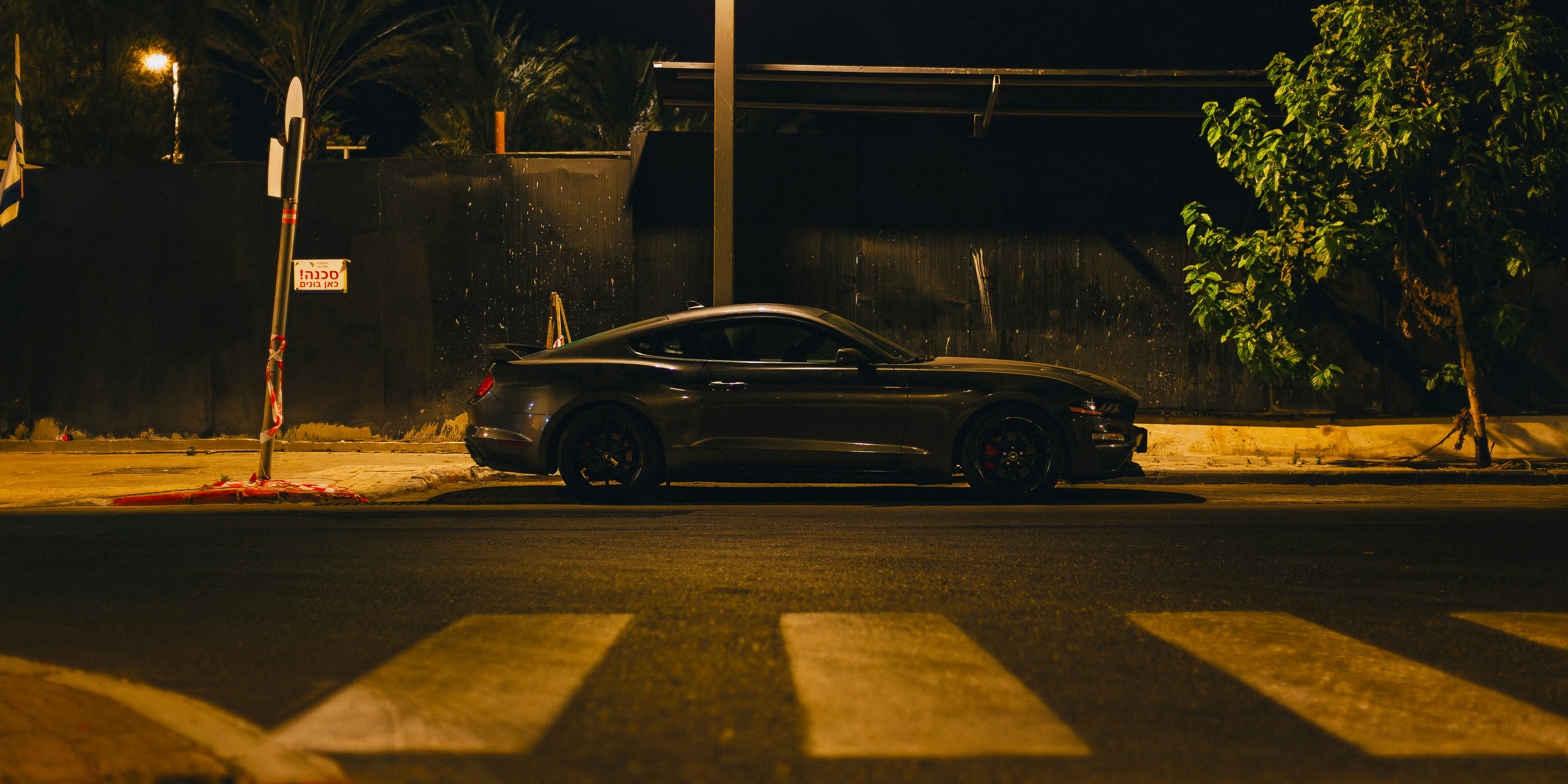 A car parked on the side of the road at night photo – Free Tel aviv ...