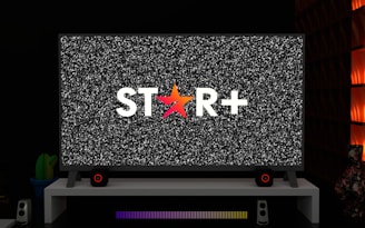 a television with a star logo on the screen