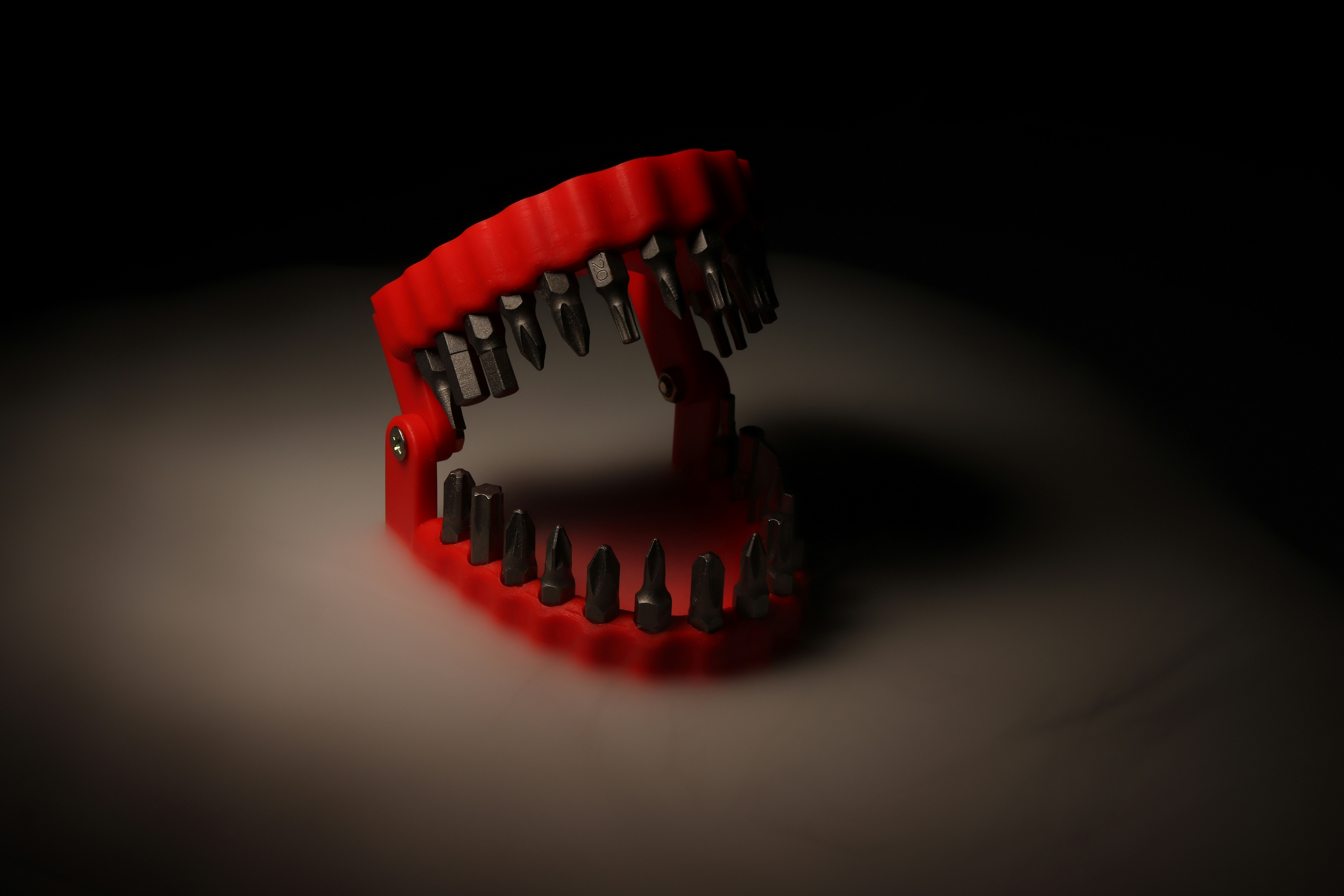 A close up of a red object in the dark photo – Free Red Image on Unsplash