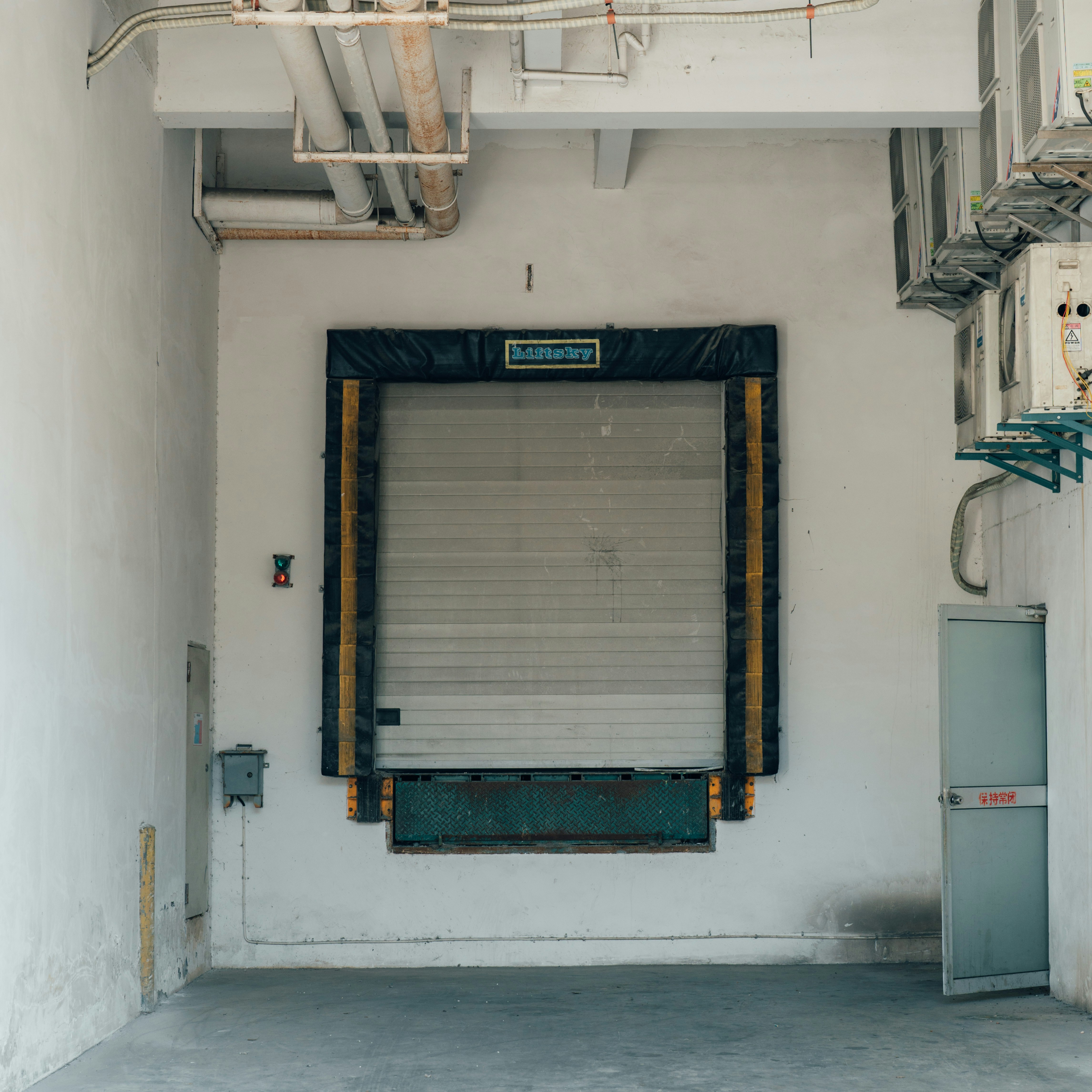 a garage with a closed door and a closed door