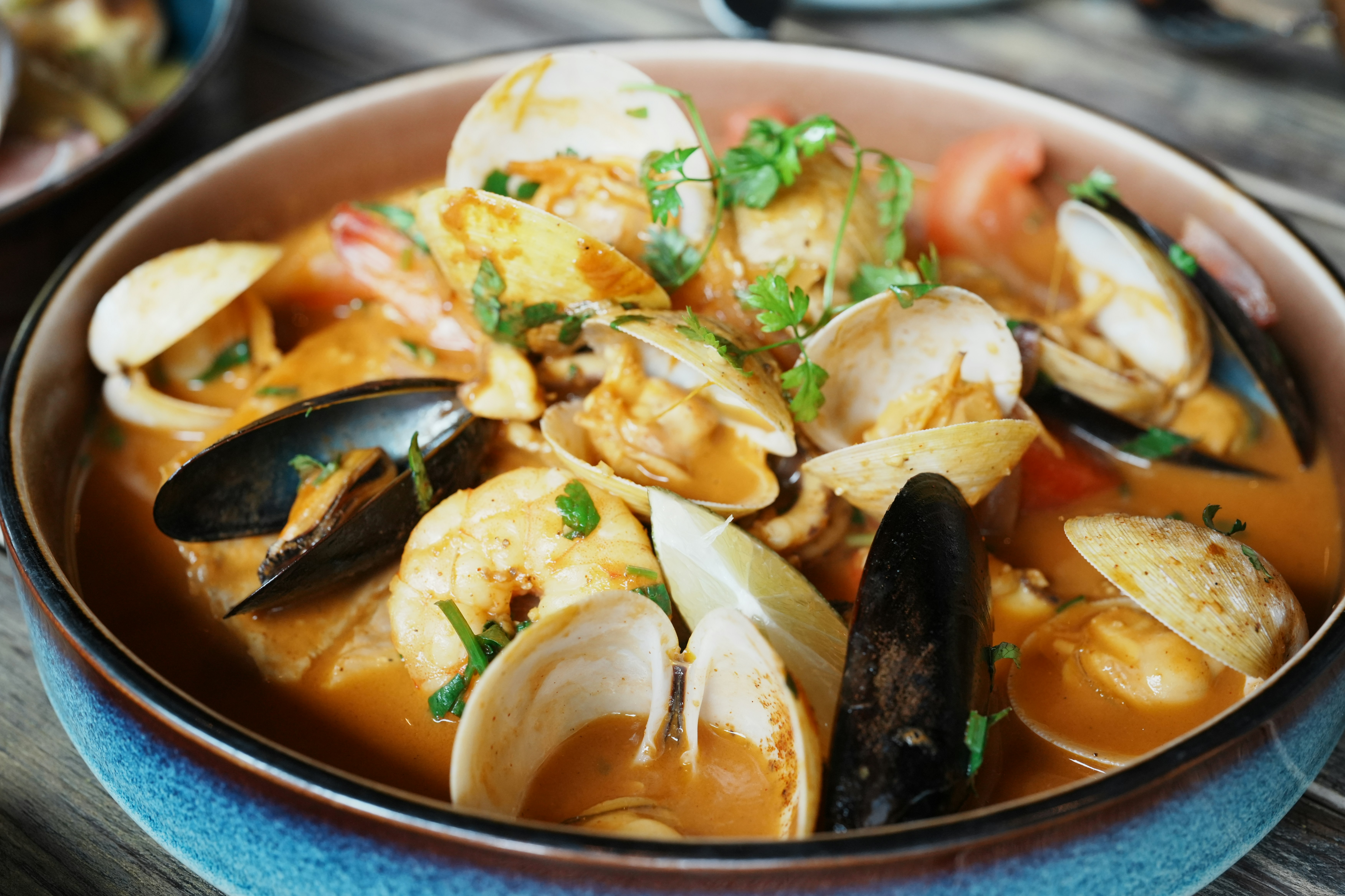 a bowl of clamber soup on a wooden table
