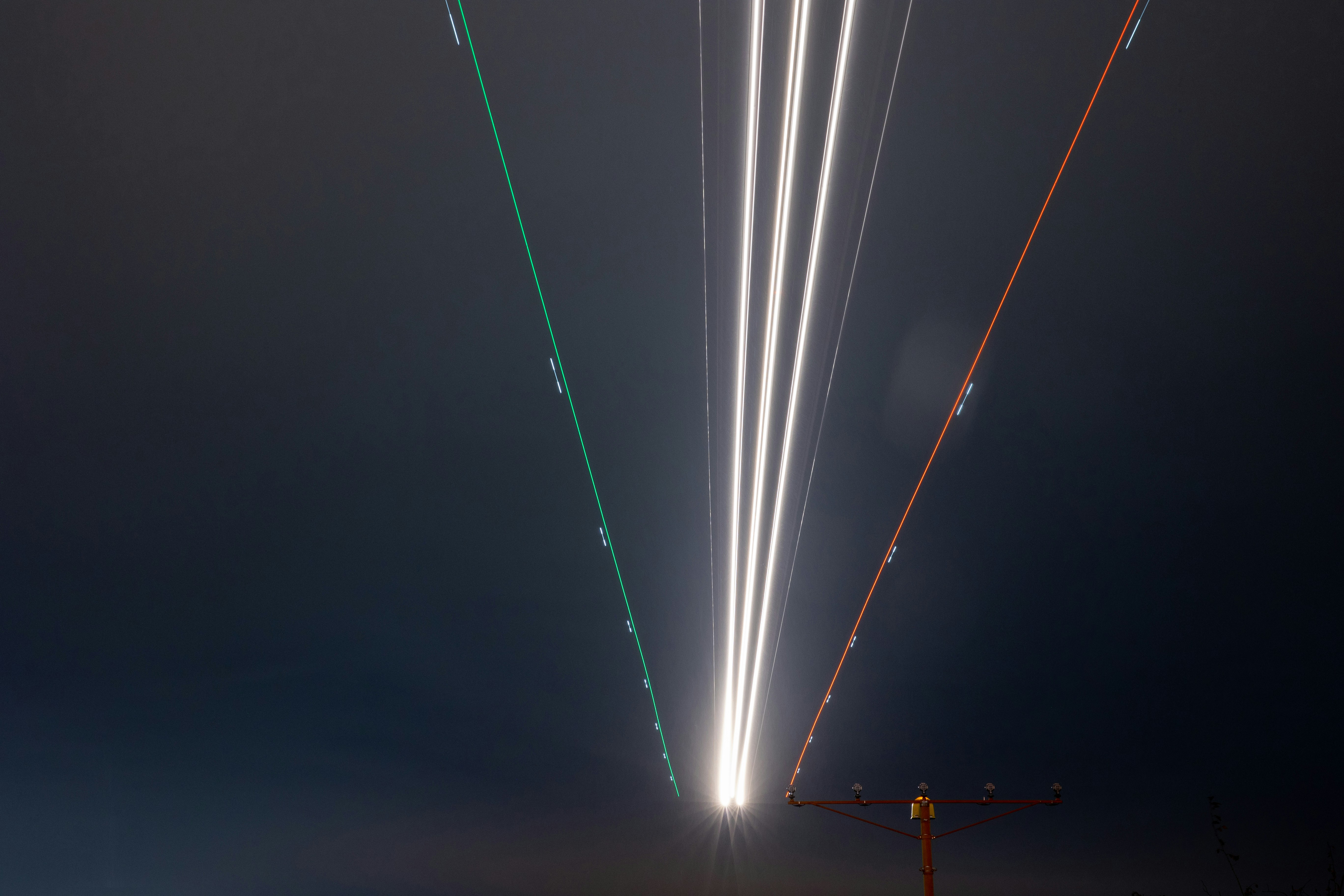 a long exposure photo of fireworks in the sky
