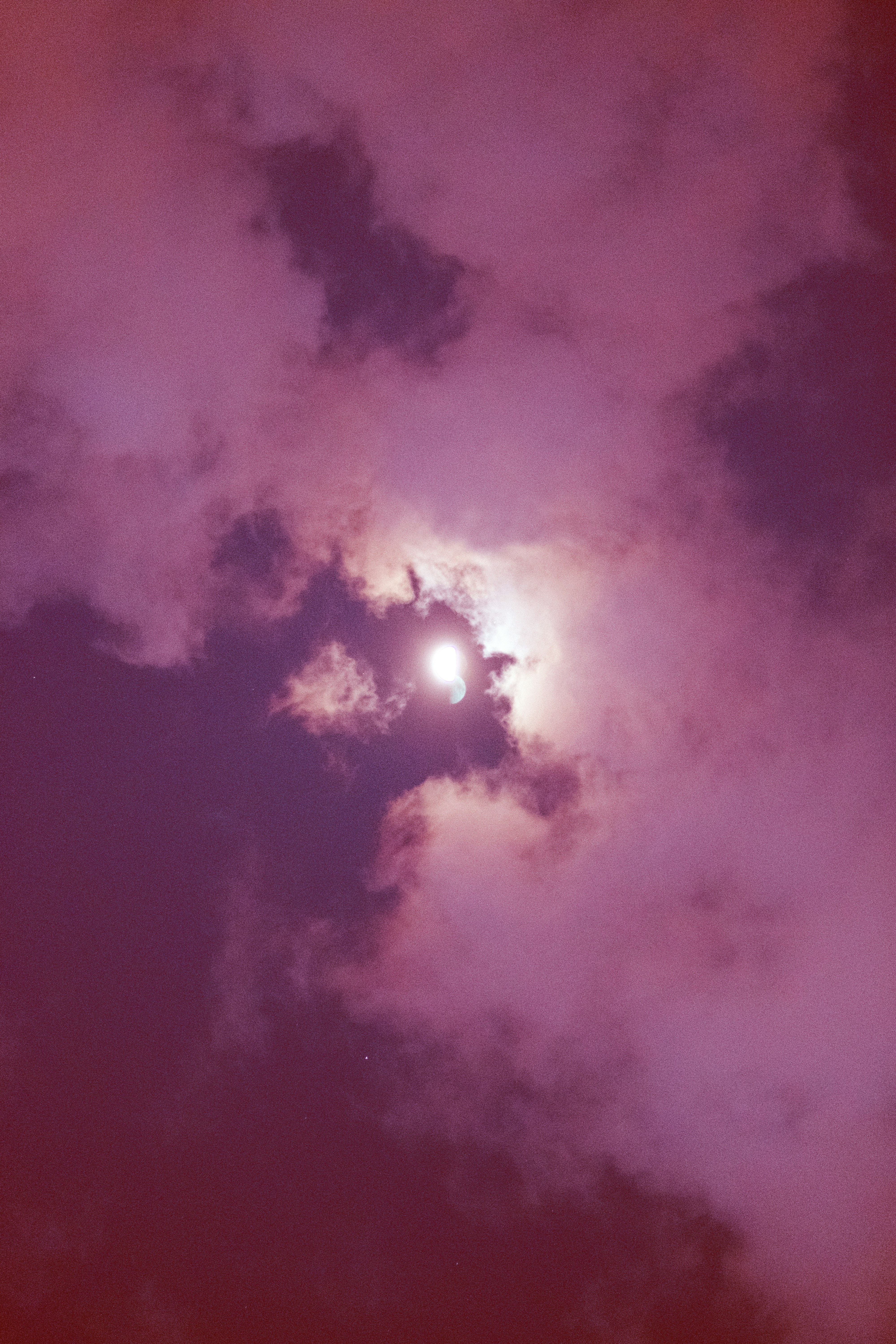 the sun is shining through the clouds in the sky