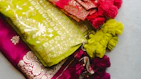 a pile of different types of cloths on a table