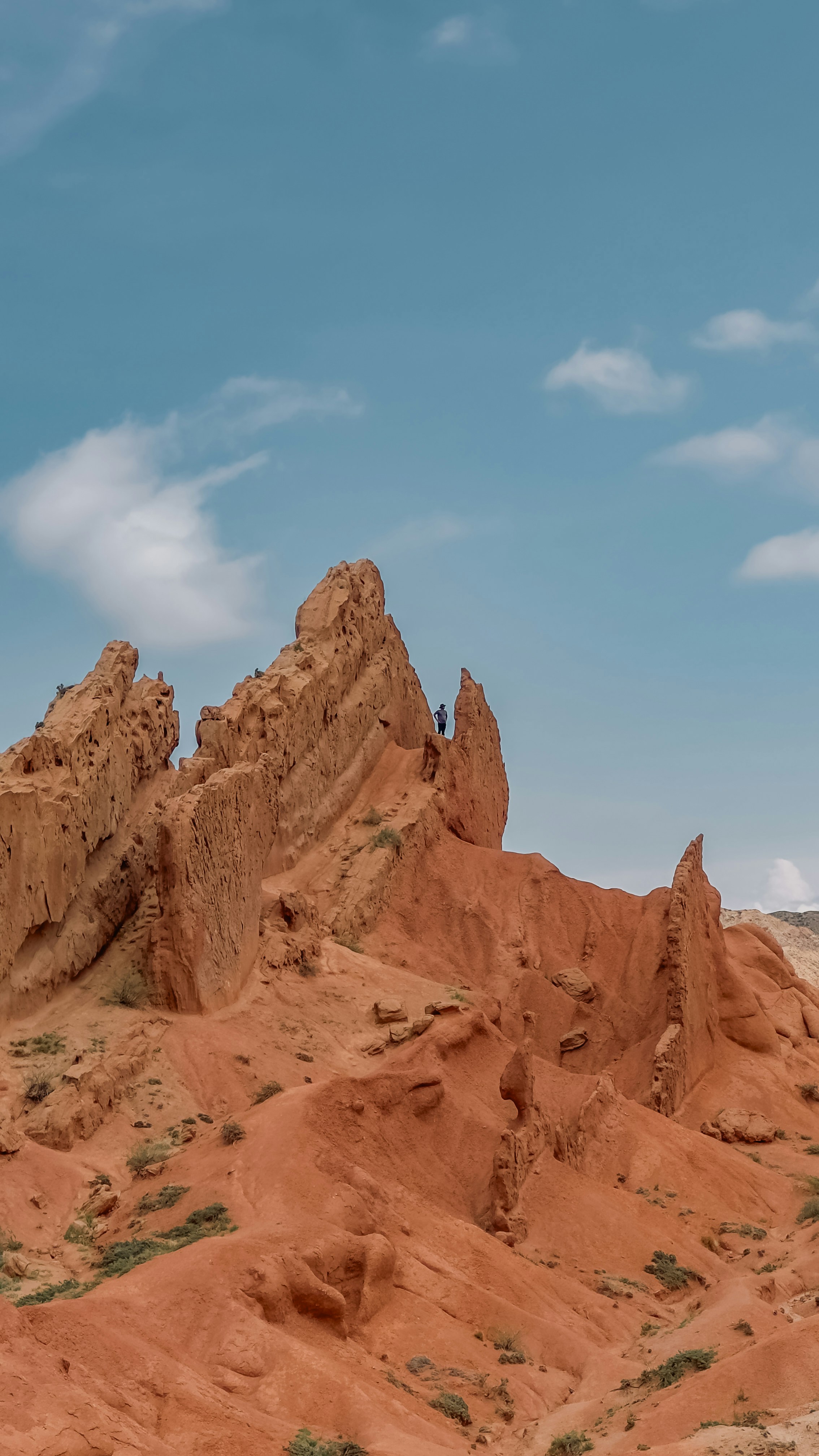 a large rock formation in the middle of a desert