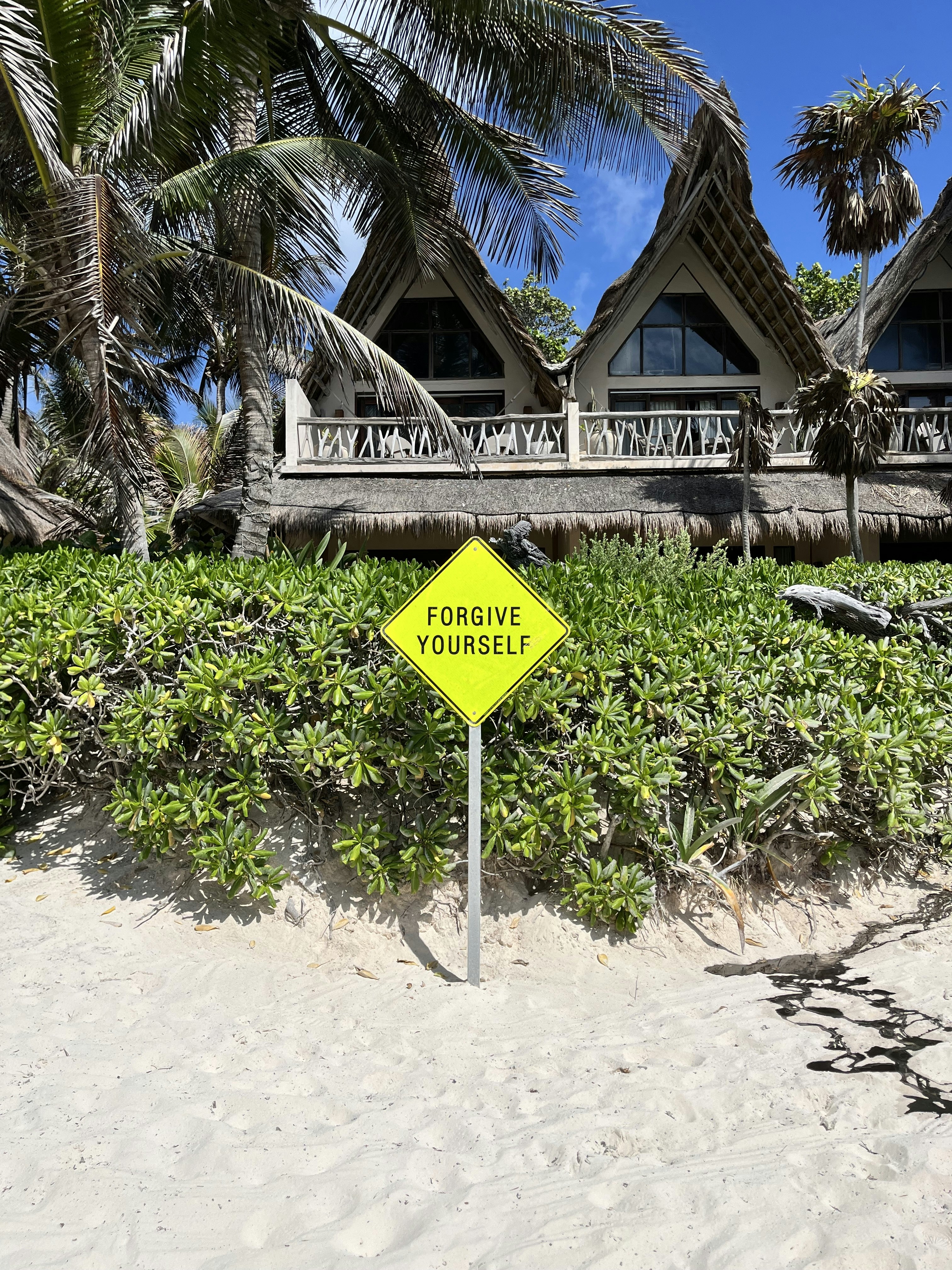 woman wearing yellow long-sleeved dress under white clouds and blue sky during daytime