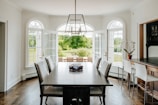 a dining room with a table and chairs