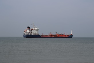 a large cargo ship in the middle of the ocean