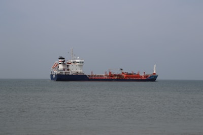 a large cargo ship in the middle of the ocean