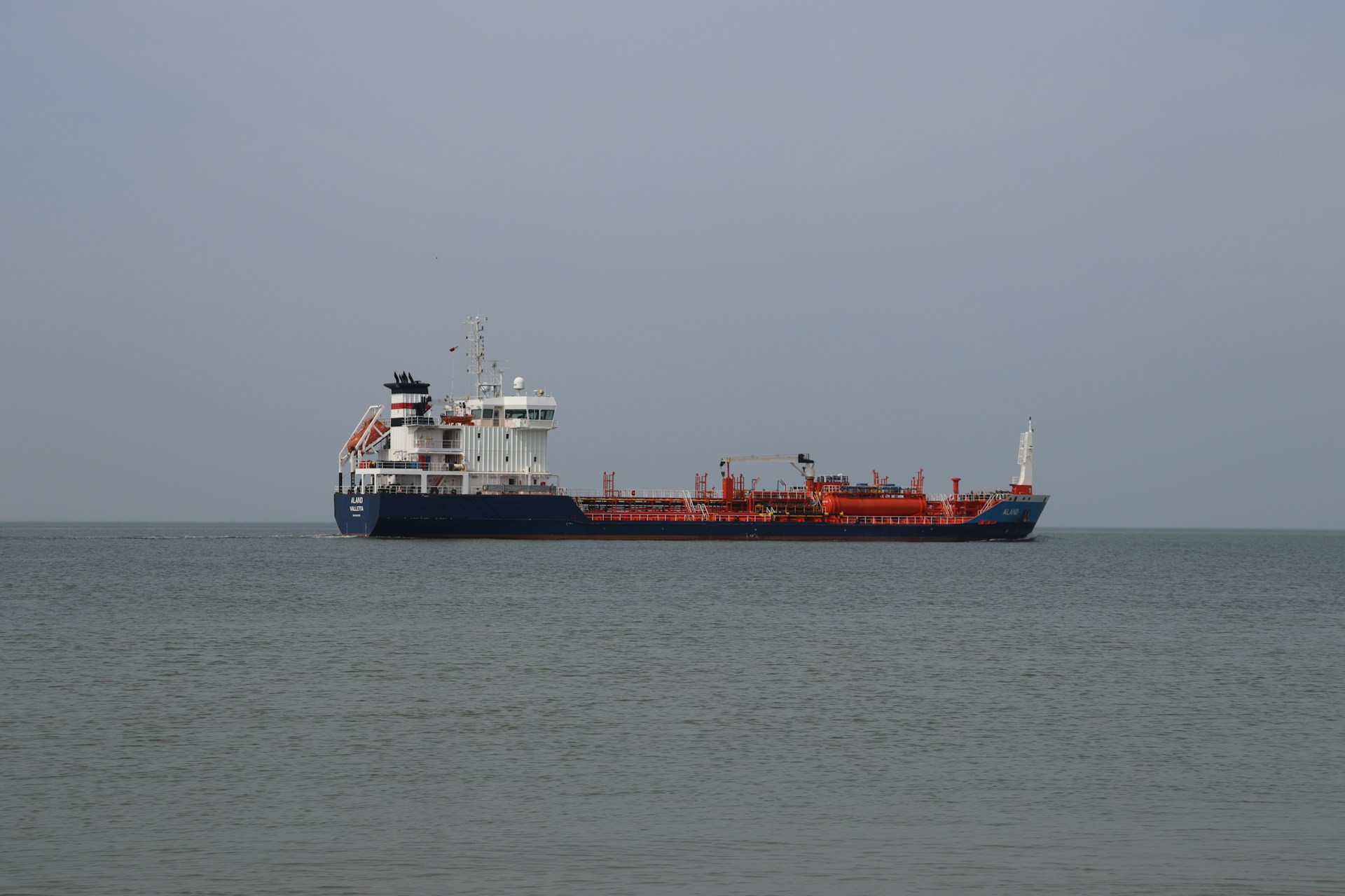 a large cargo ship in the middle of the ocean