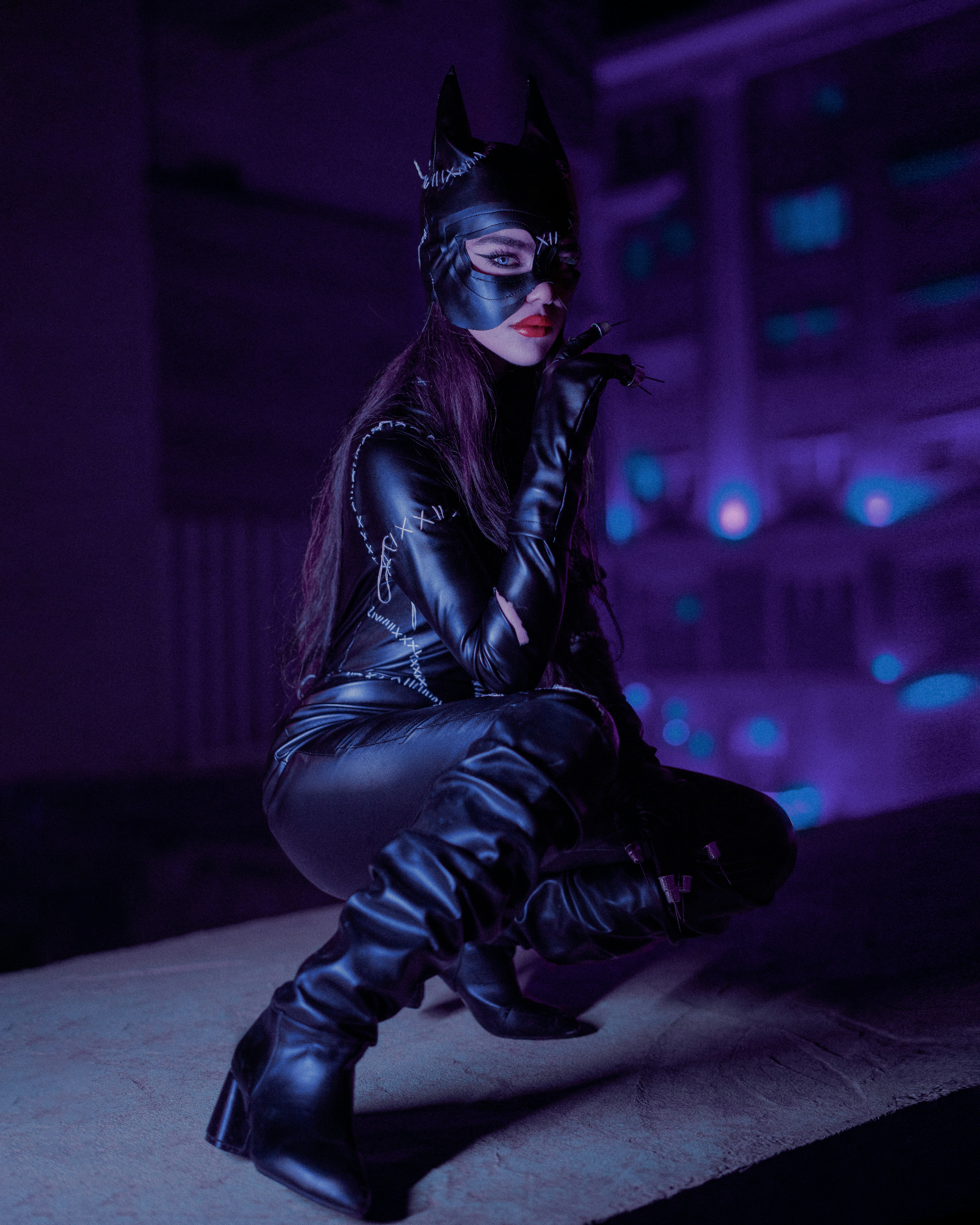 a woman dressed in a catwoman costume