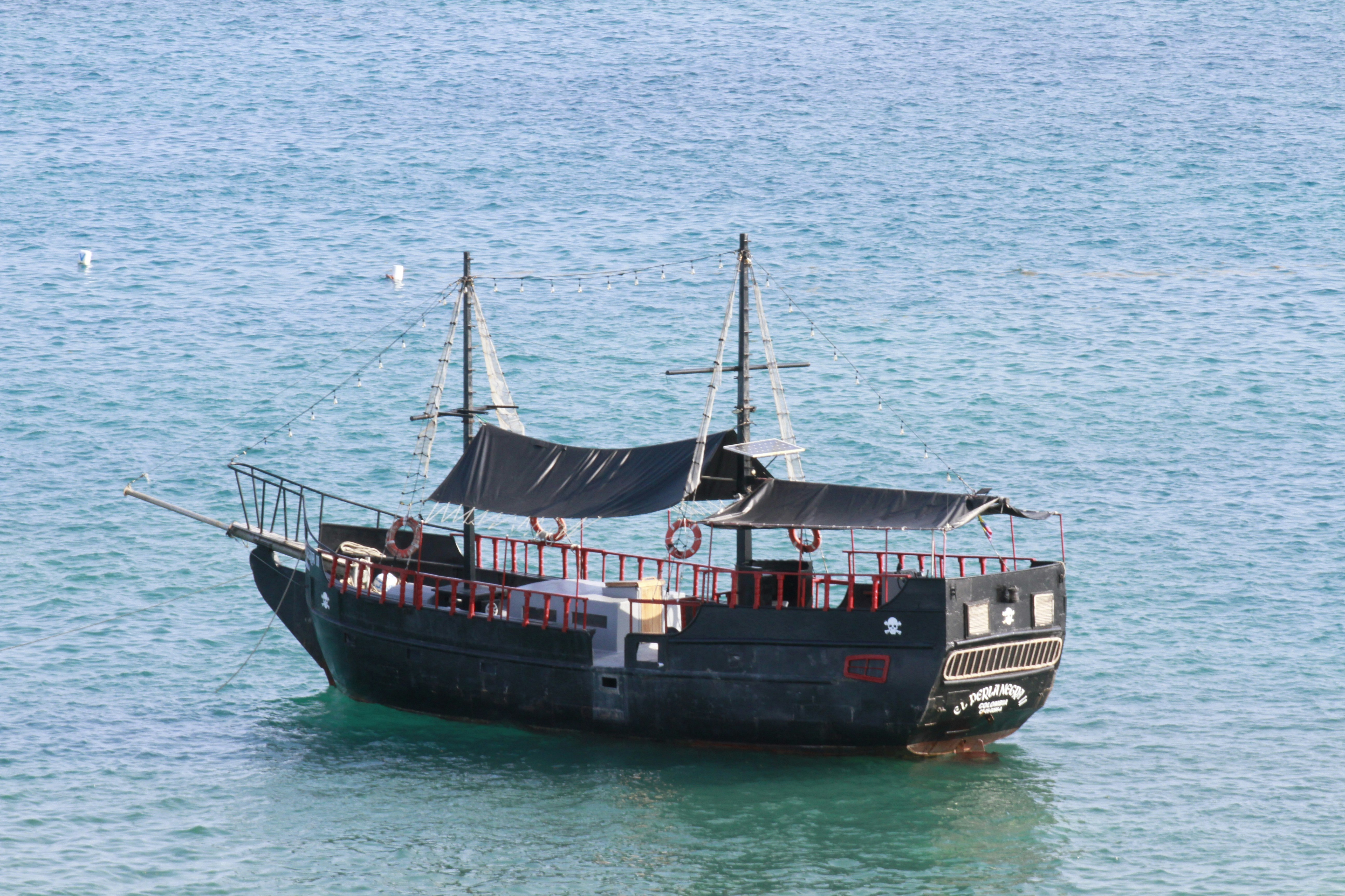 a boat floating on top of a body of water