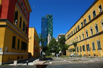 a city street lined with tall buildings next to each other