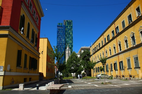 a city street lined with tall buildings next to each other