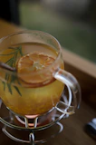 a close up of a drink in a glass on a table