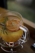 a close up of a drink in a glass on a table