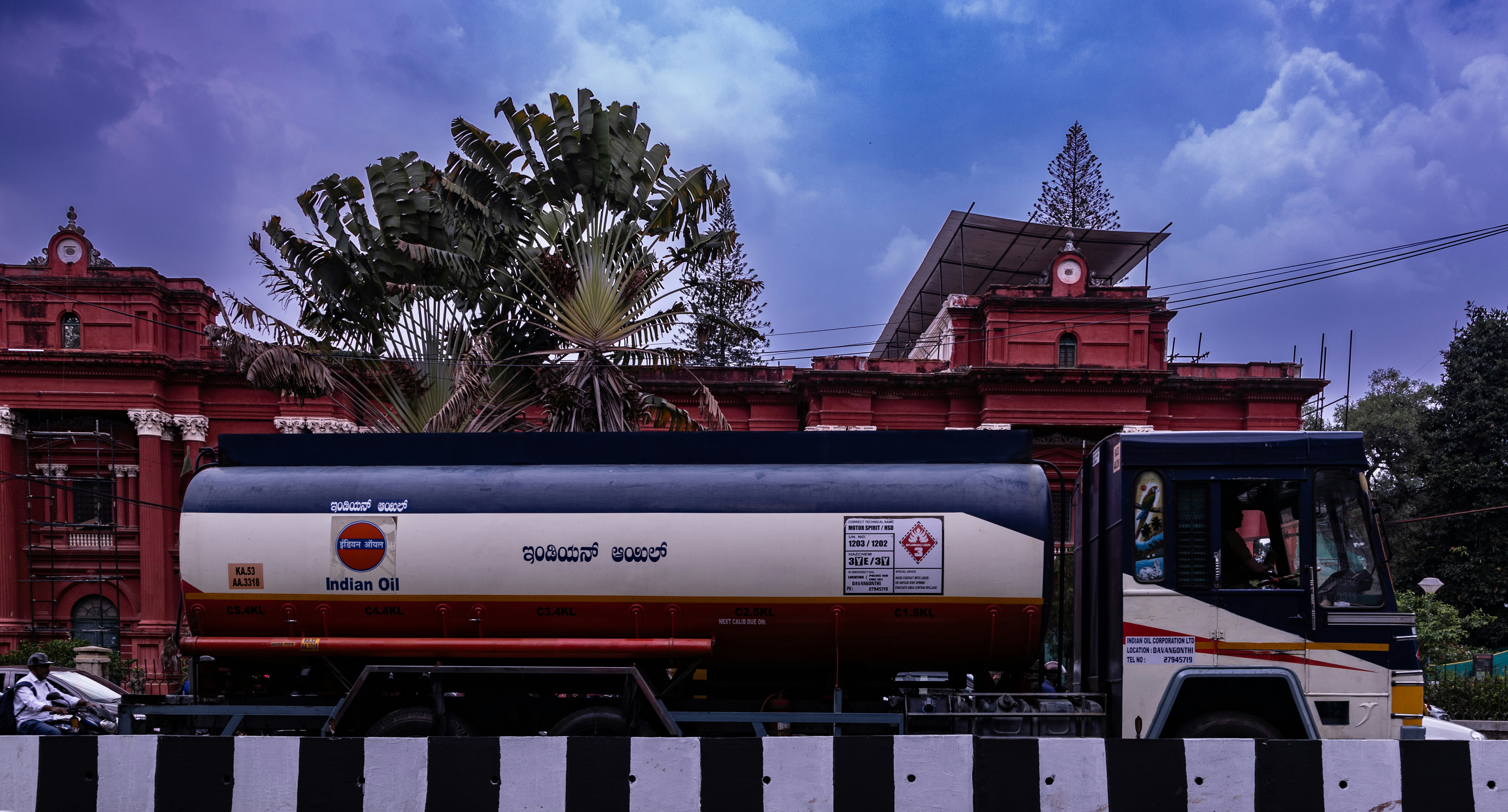 a large tanker truck driving down a street