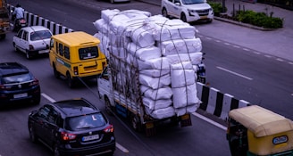 a truck with a load of bags on the back of it
