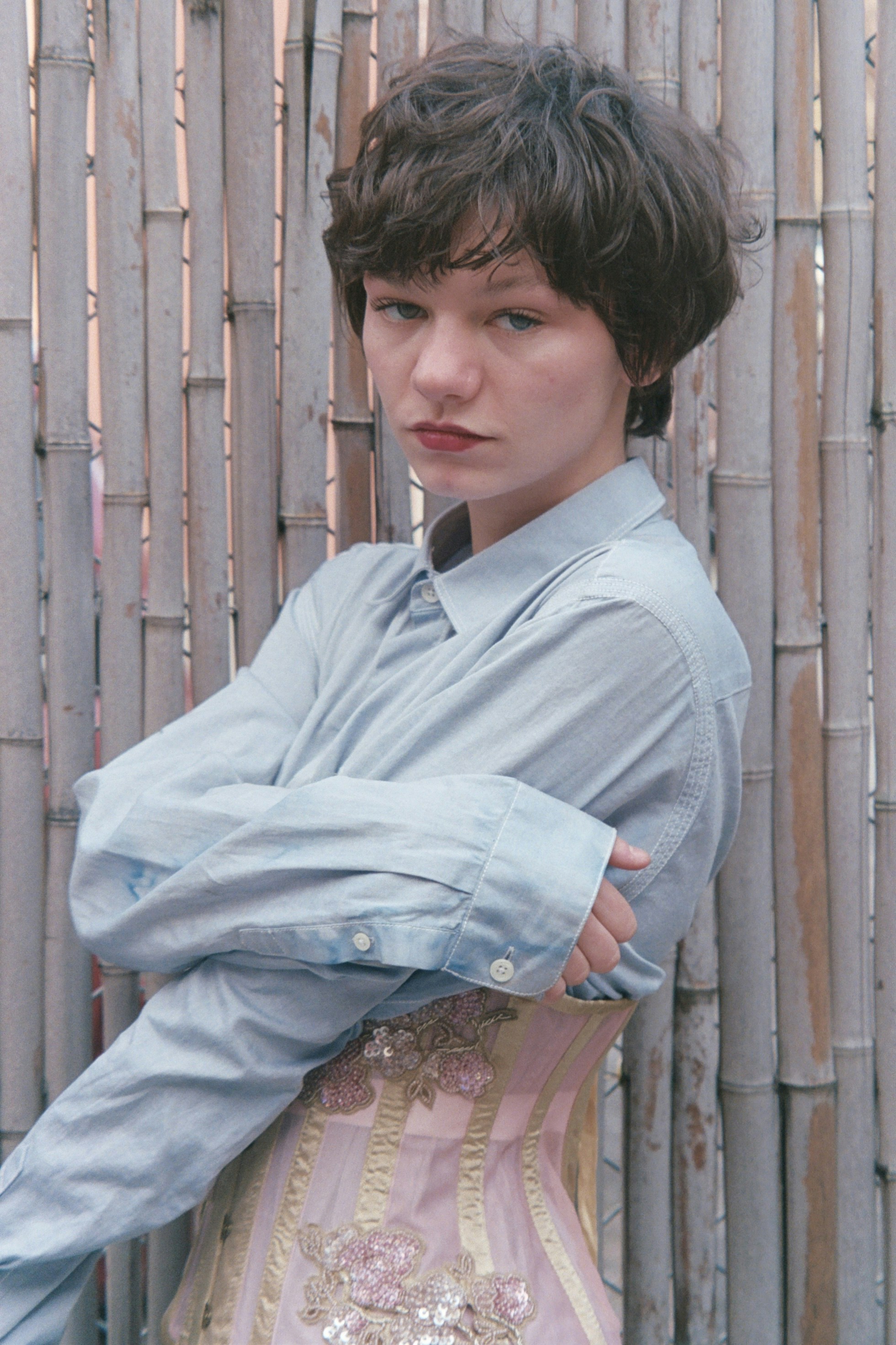 A woman in a dress posing for a picture