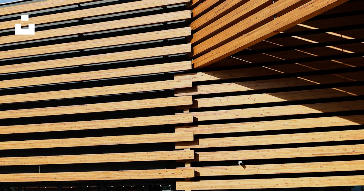 Building Slats A large building with wooden slats on the side of it photo – Free ...