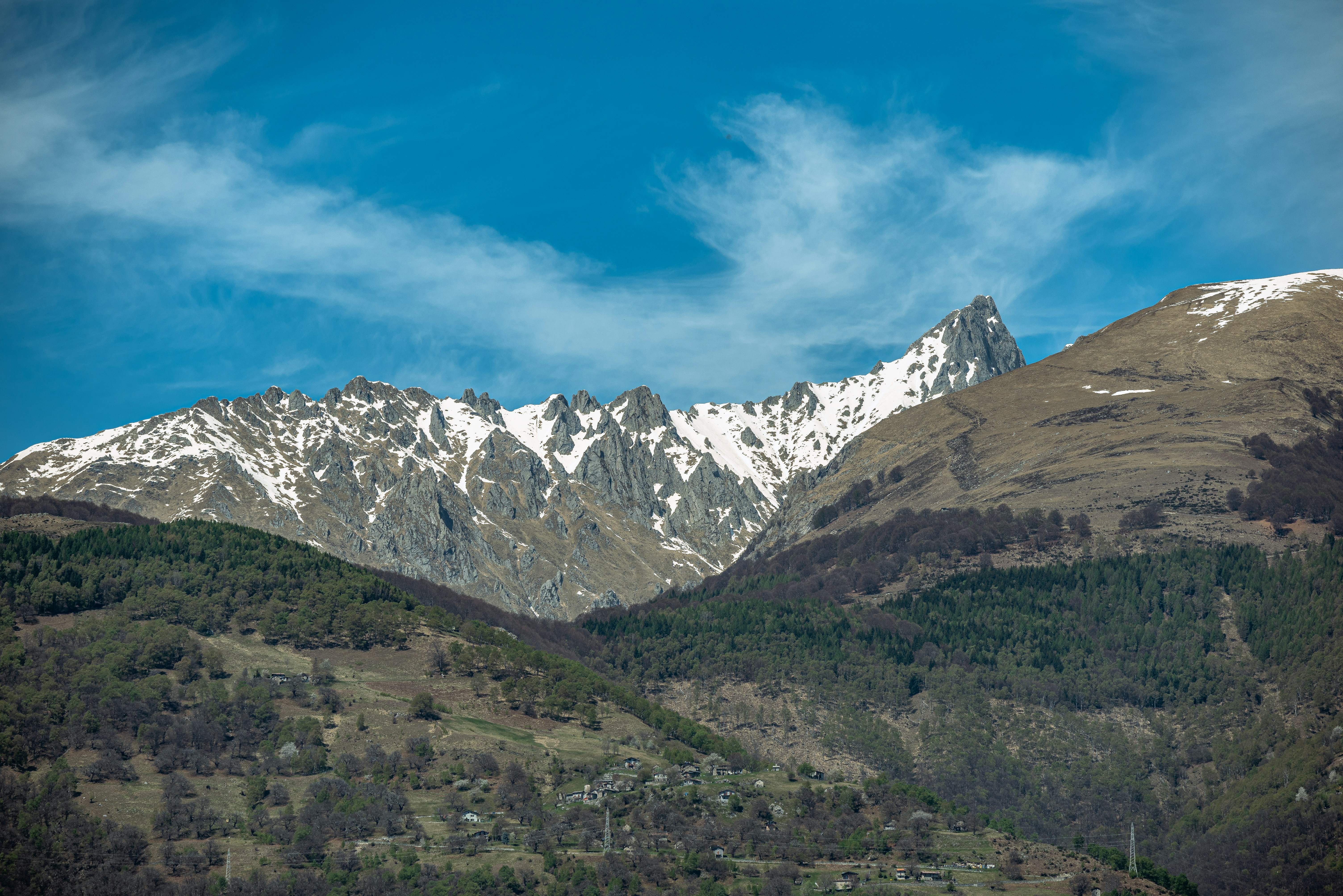 a view of a mountain range with snow on the top