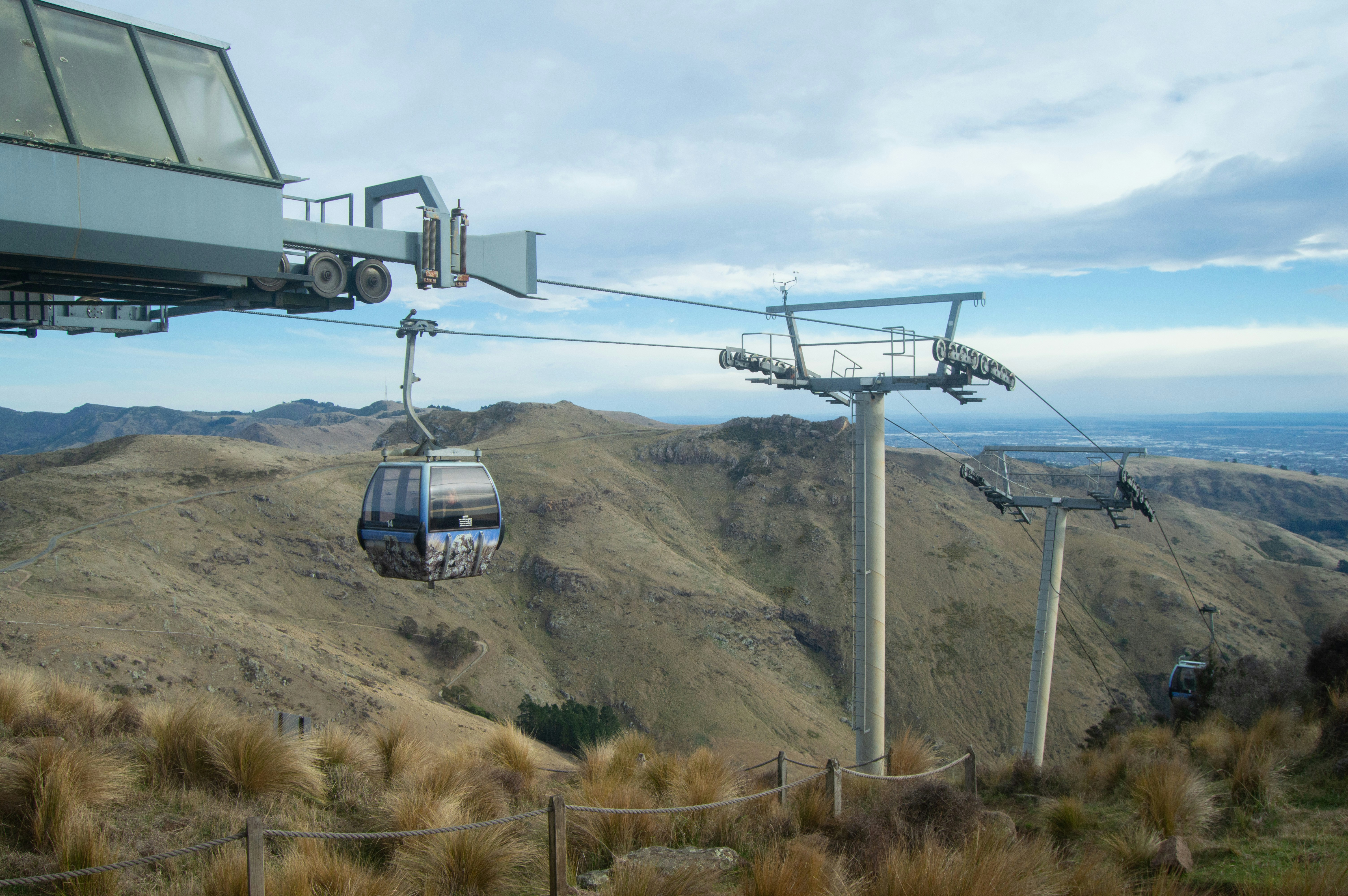 a cable car going up the side of a mountain