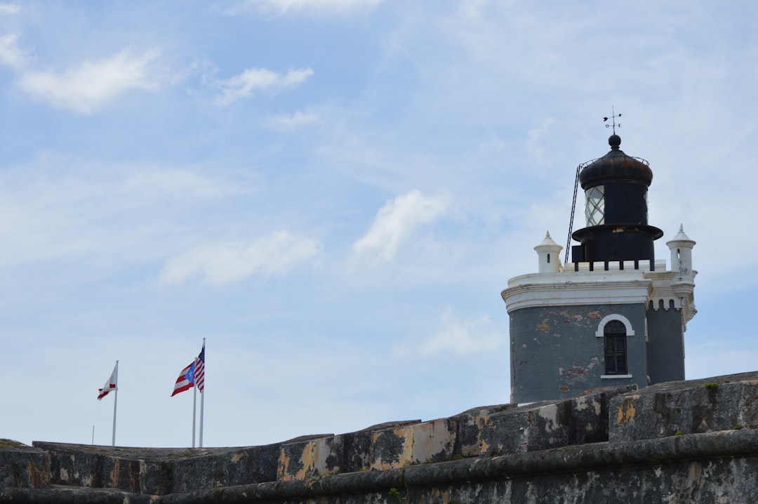a tower with a flag on top of it,