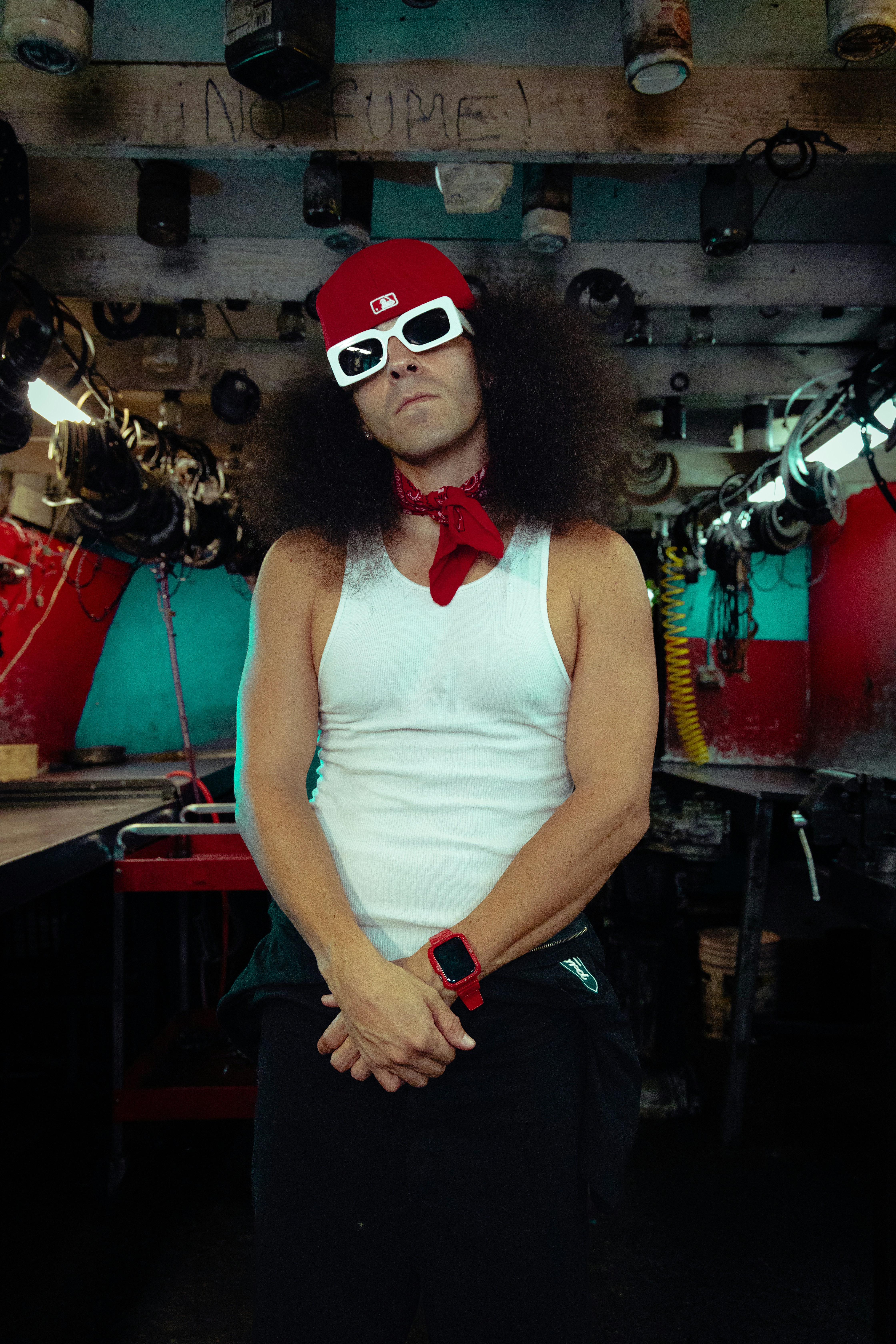 a man wearing a red hat and sunglasses