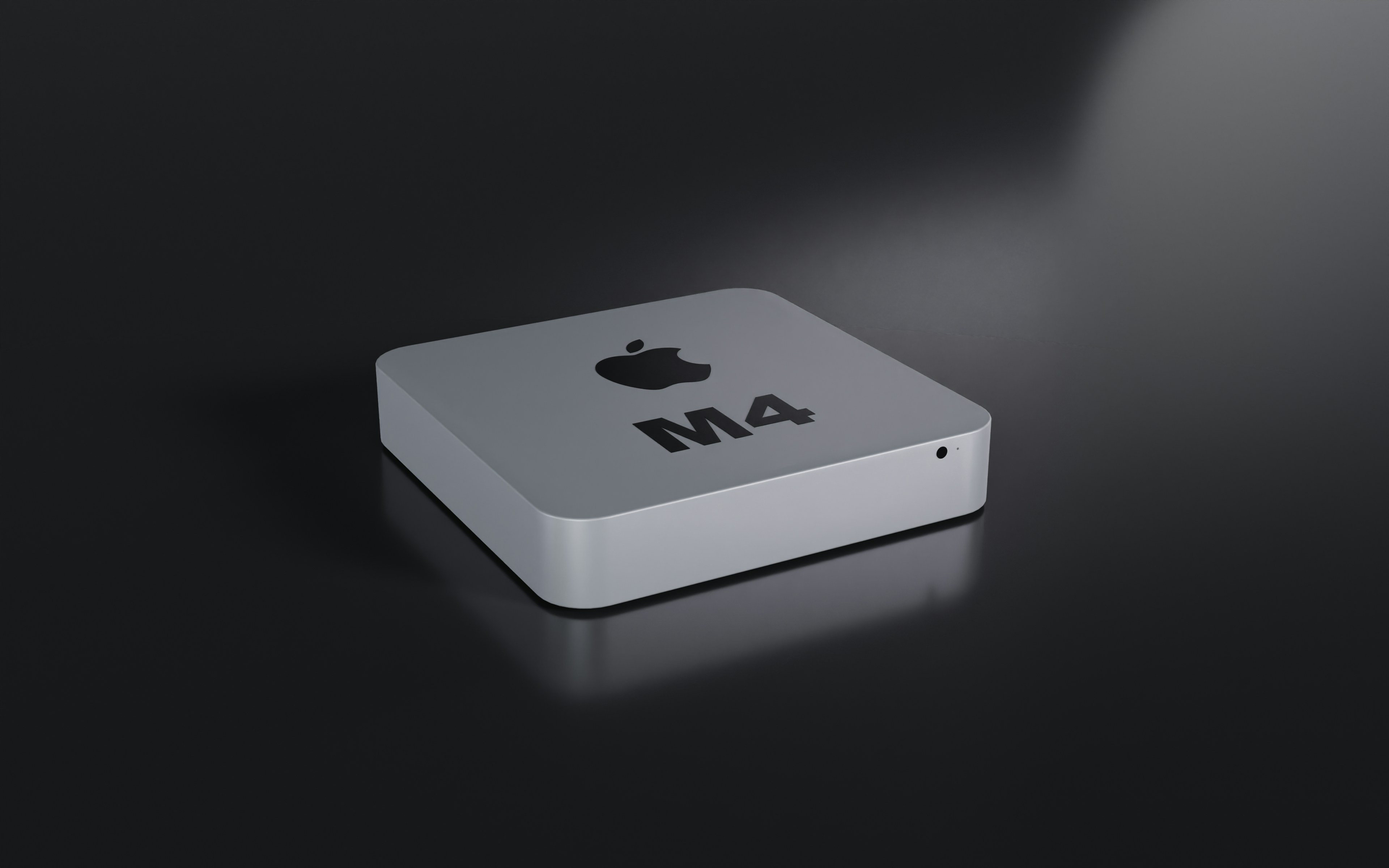 a close up of an apple product on a black surface