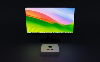 a computer monitor sitting on top of a desk