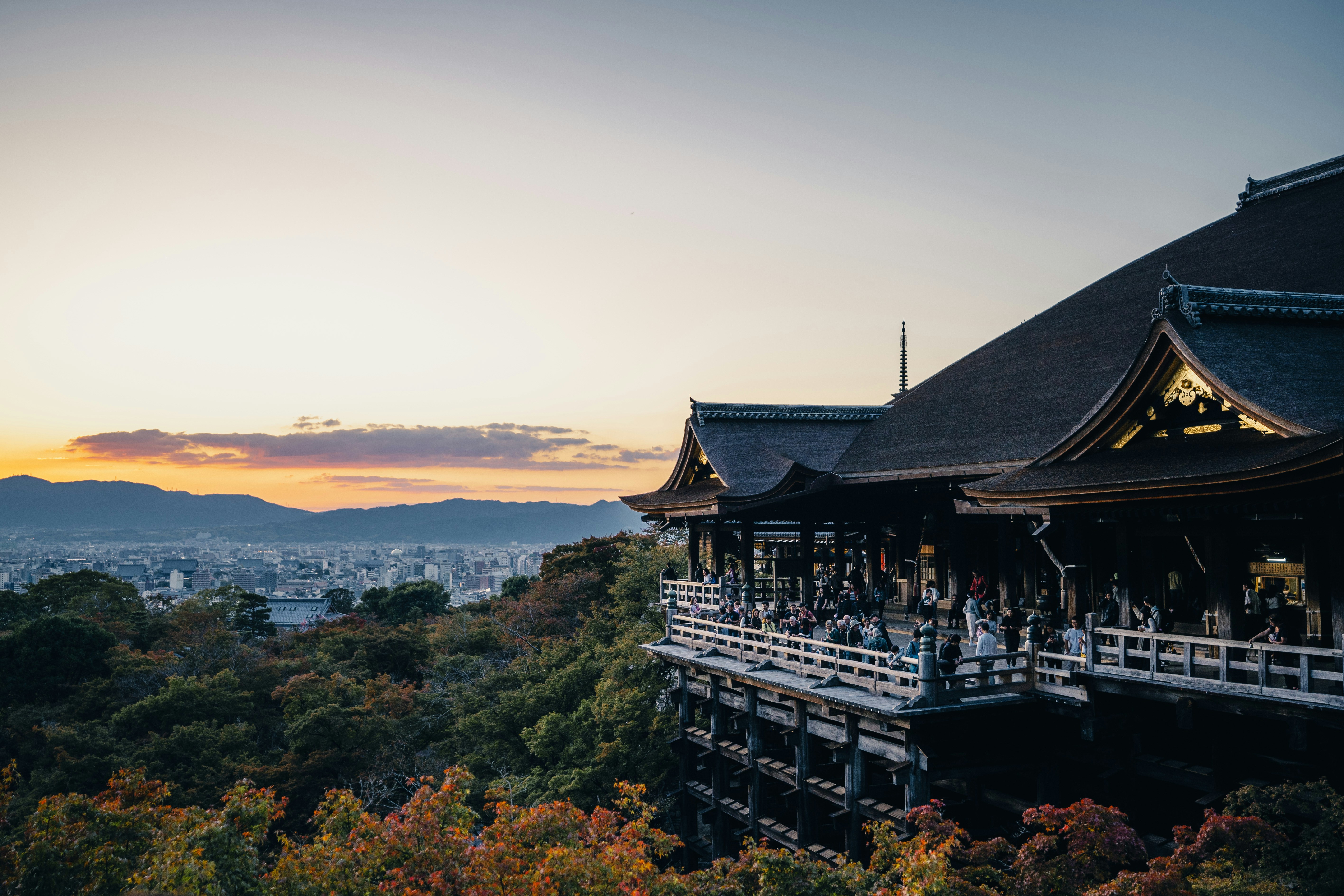 a view of a building with a sunset in the background