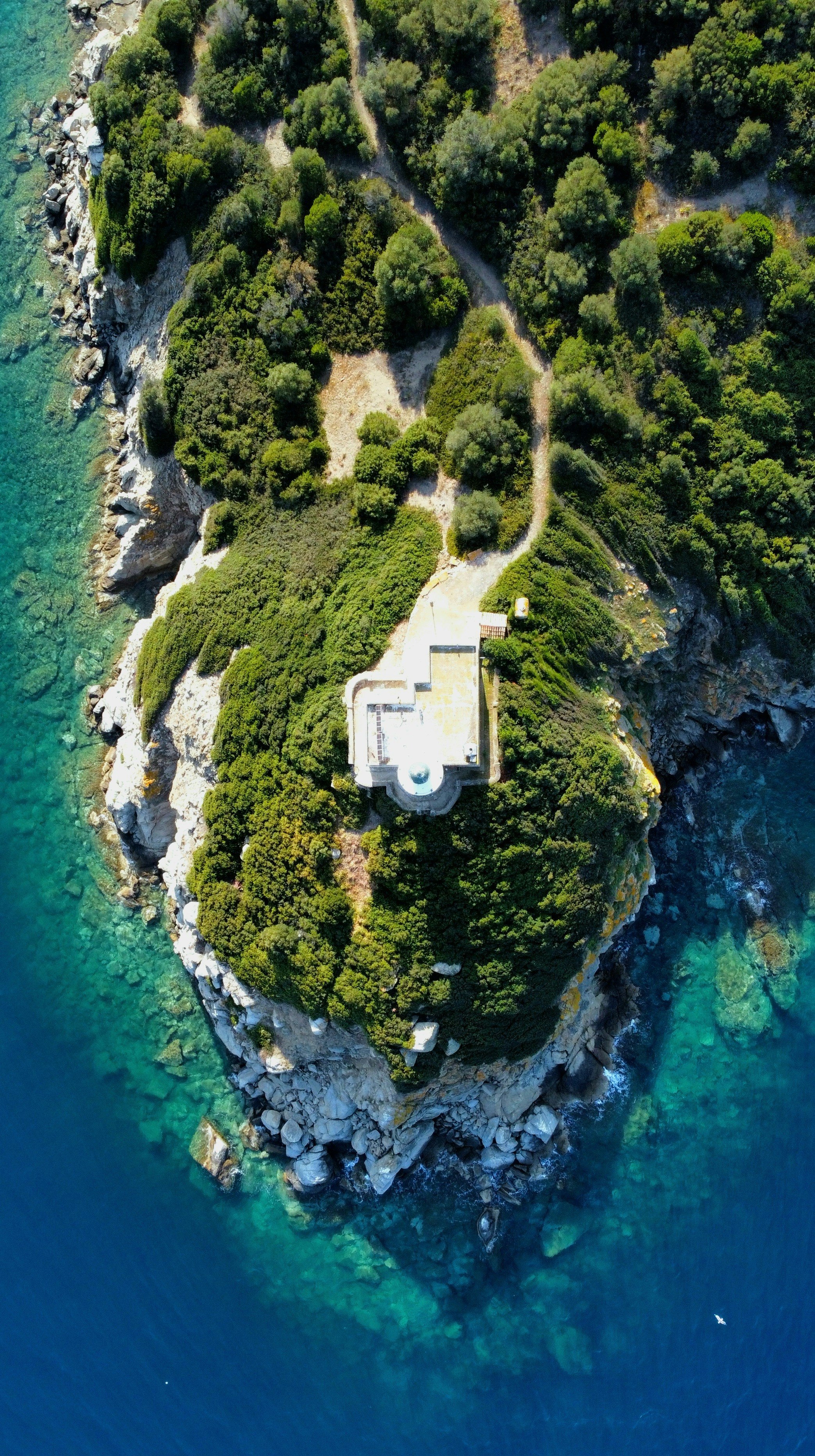 an aerial view of an island in the middle of the ocean