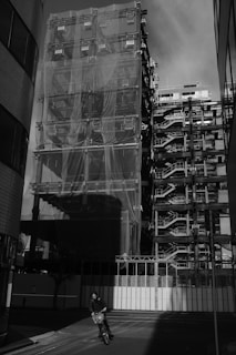 a motorcycle parked in front of a tall building