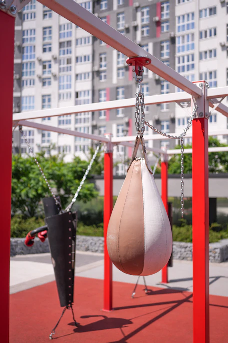 a swing set with a punching bag hanging from it