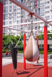 a swing set with a punching bag hanging from it