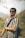 a man with a backpack and sunglasses on
