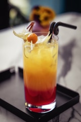 a drink sitting on top of a tray on a table