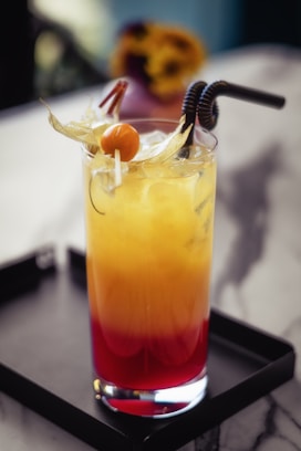 a drink sitting on top of a tray on a table