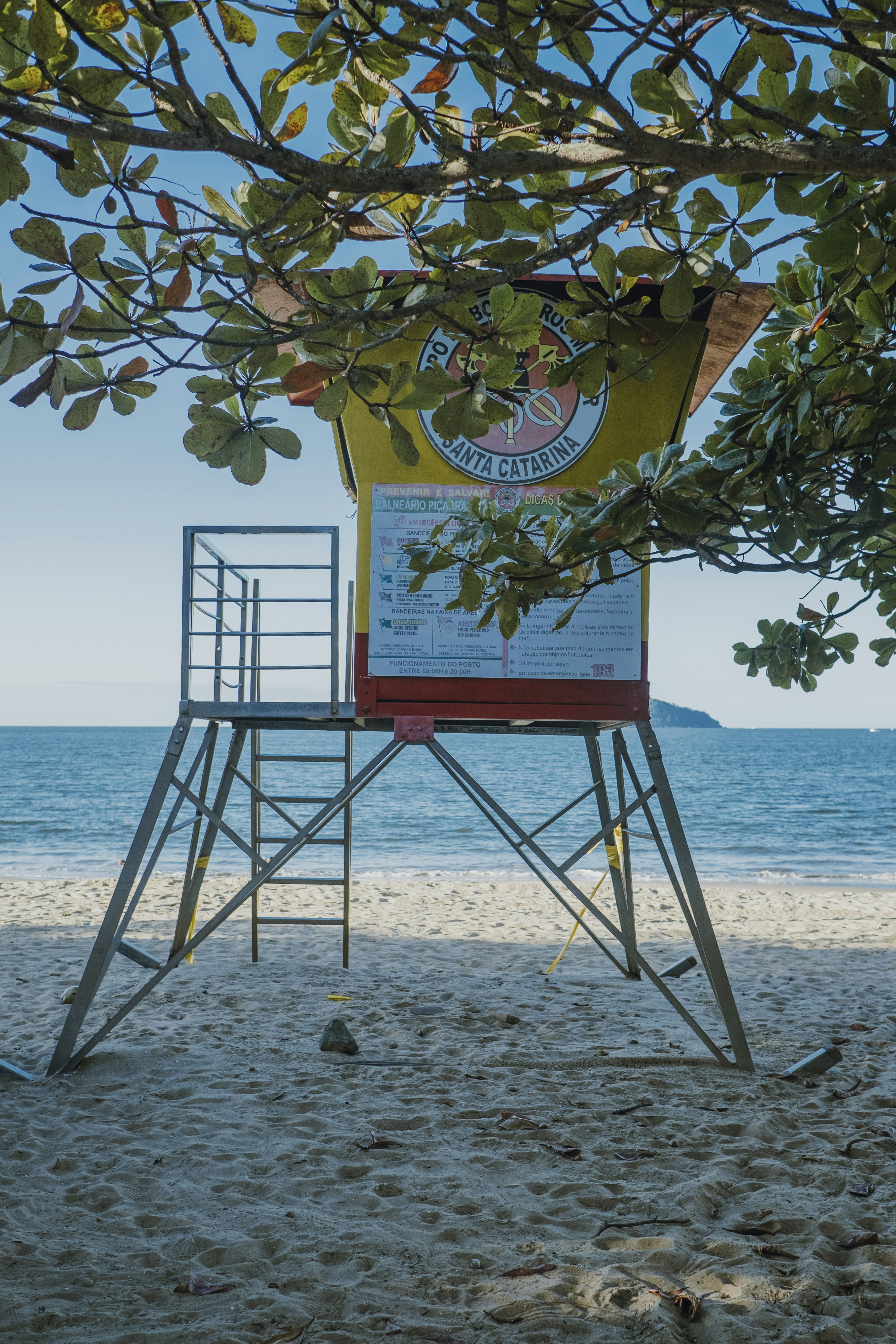 a lifeguard stand on a beach with a view of the ocean