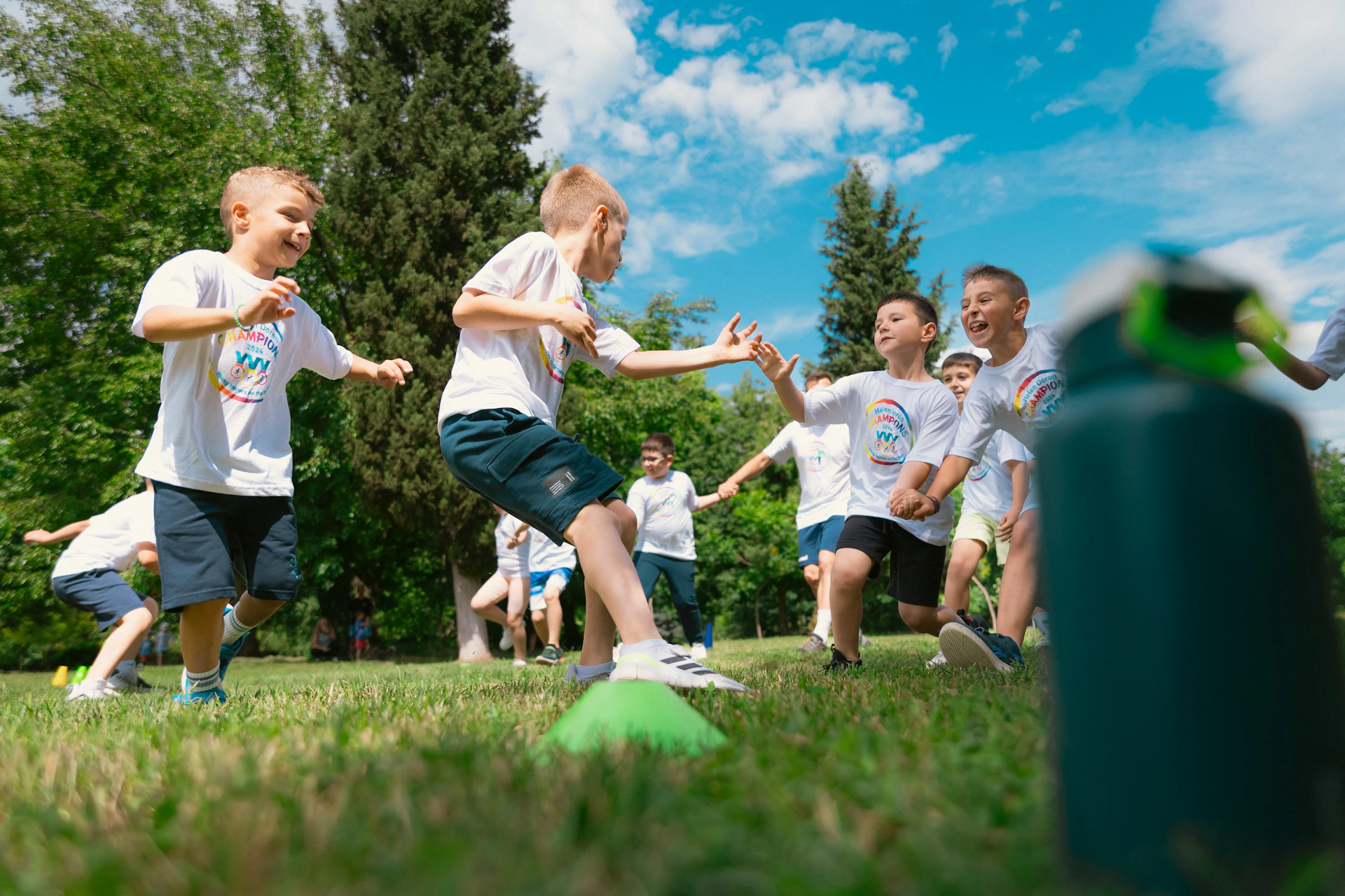 a group of young boys playing a game of frisbee
