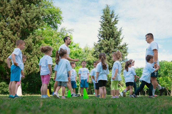 a group of young children standing next to each other