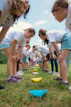a group of young girls playing a game of frisbee