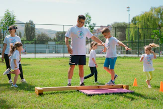 a group of people playing a game of frisbee