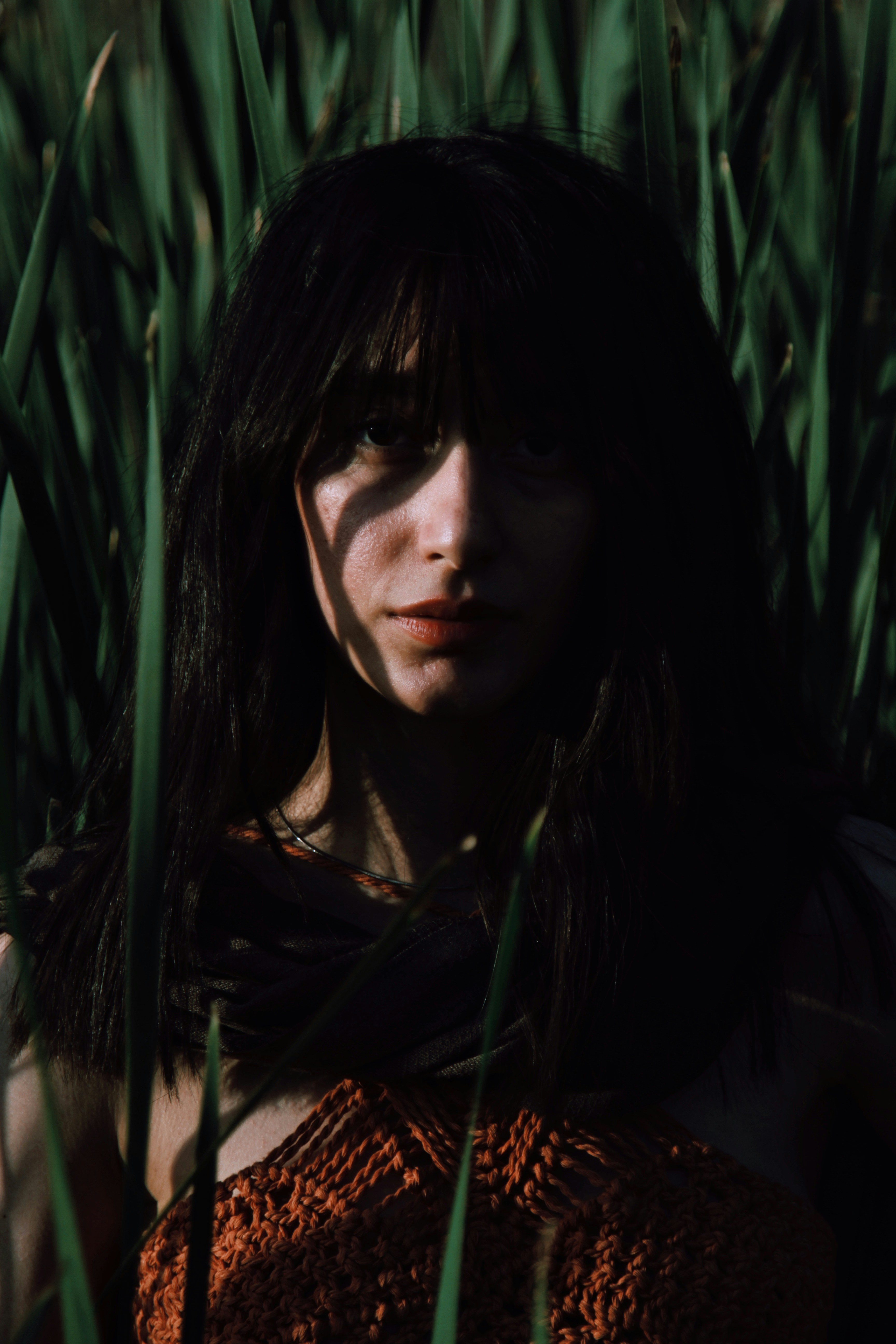 A woman standing in a field of tall grass photo – Free Portrait Image ...