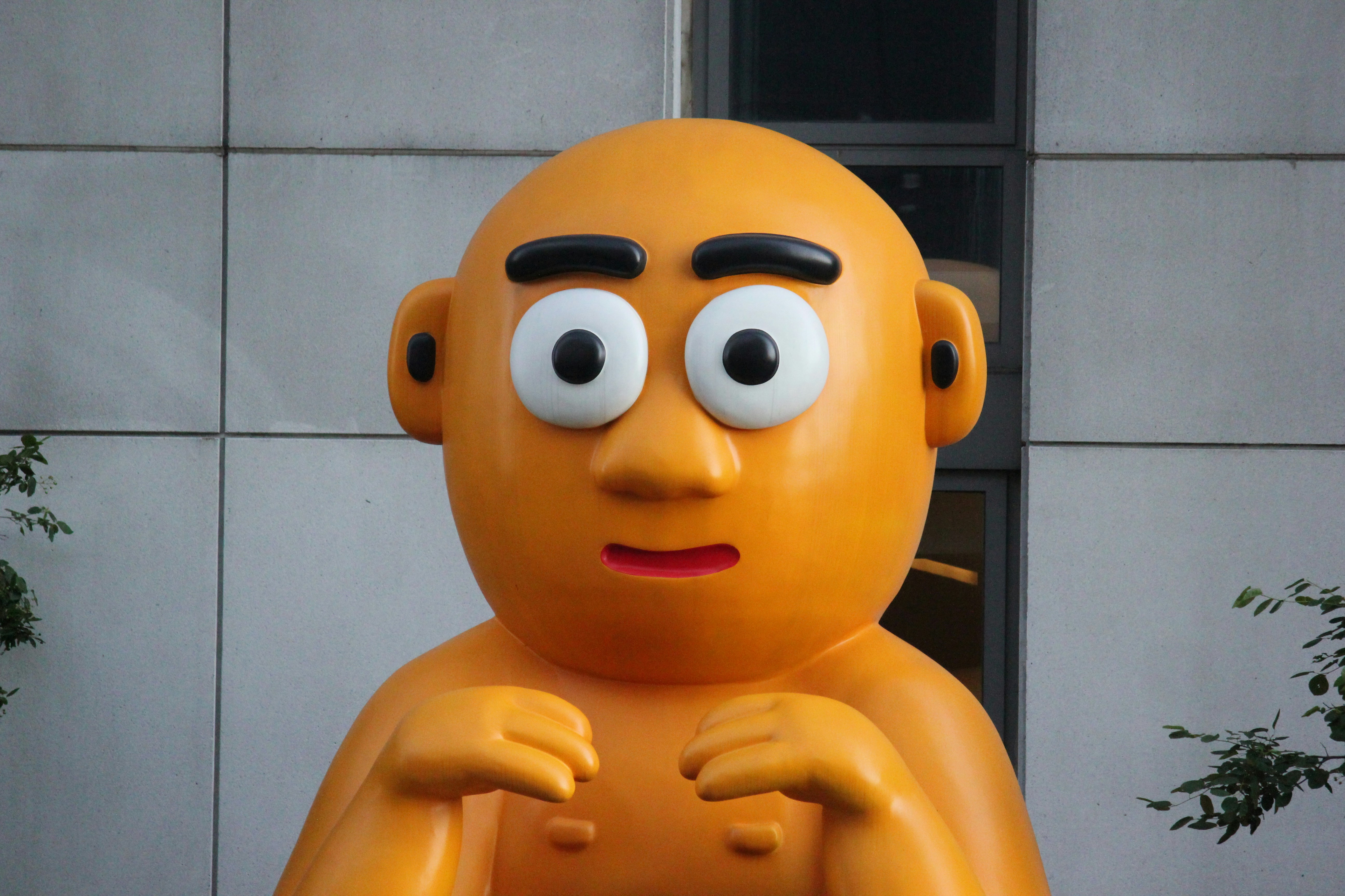 a large statue of a man with a surprised look on his face