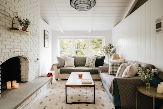 a living room filled with furniture and a fire place
