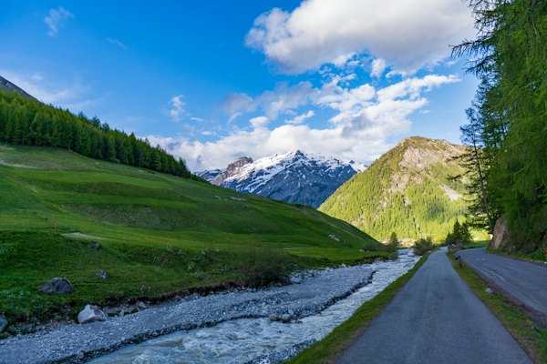 A mountain valley with a river running through it — Livigno, Italy