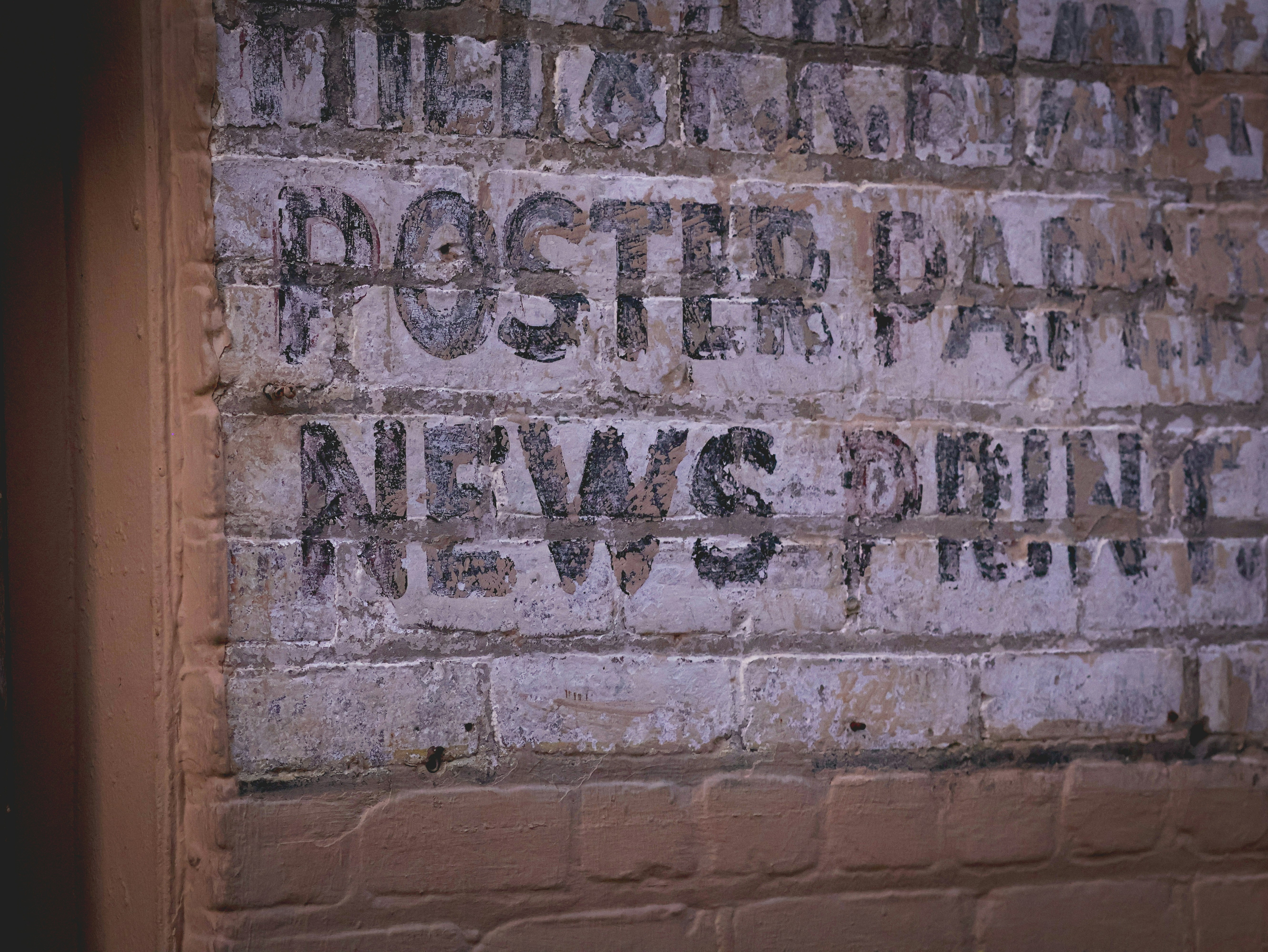 a brick wall with some writing on it